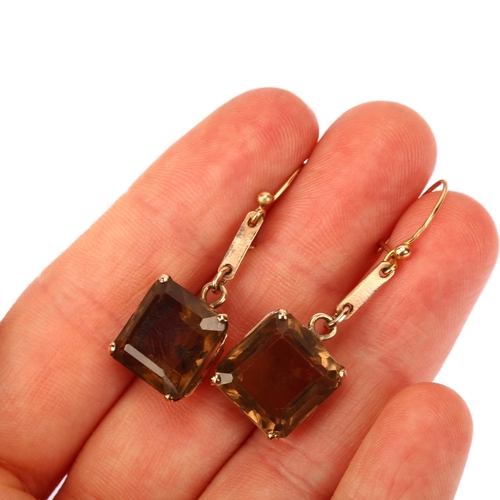 1168 - A pair of 9ct gold smoky quartz drop earrings, set with square step-cut quartz and shepherd hook fit... 