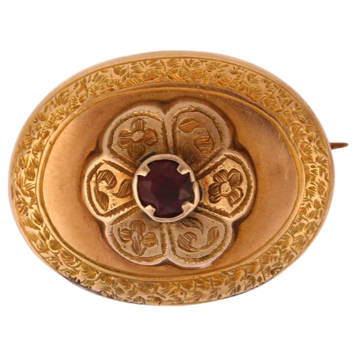 1170 - A Victorian garnet memorial brooch, unmarked yellow metal closed-back settings, of oval form with ce... 