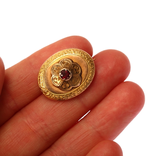 1170 - A Victorian garnet memorial brooch, unmarked yellow metal closed-back settings, of oval form with ce... 