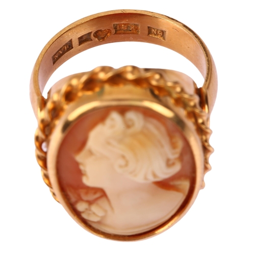 1171 - A Swedish 18ct gold shell cameo ring, relief carved depicting female profile within rope twist surro... 