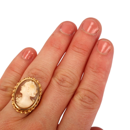 1171 - A Swedish 18ct gold shell cameo ring, relief carved depicting female profile within rope twist surro... 