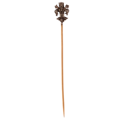 1173 - A 19th century diamond fleur-de-lis stickpin, unmarked gold and silver settings with rose-cut diamon... 