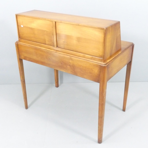 2015 - A mid-century teak writing desk, attributed to Reynolds of Ludlow, the raised compartment having a l... 