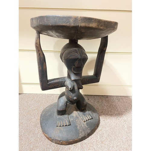 152 - Congo African Tribal carved wood stool, supported by a figure, height 42cm, and a carved and painted... 