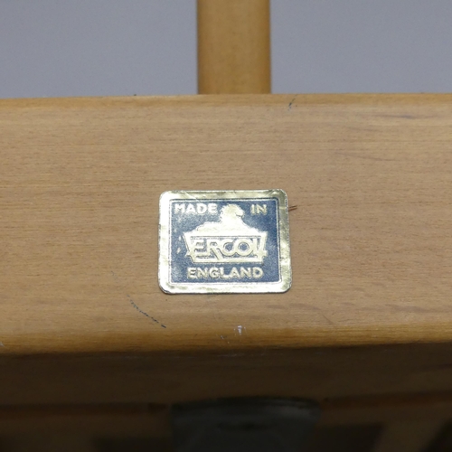 A midcentury Ercol Windsor 203 beech twoseater sofa in Golden Dawn finish, with blue maker's label