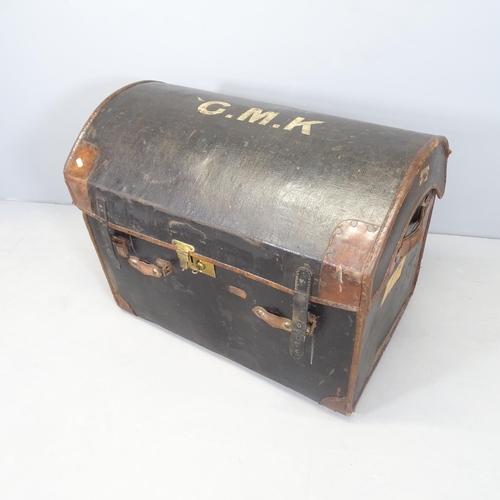 2569 - An antique leather covered and bound dome top trunk, with white lettering to top - G.M.K. 84x67x58cm... 