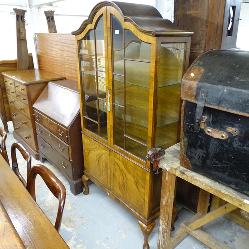 2571 - A continental walnut veneered arch topped display cabinet with 2 glazed doors and cupboard under, ra... 