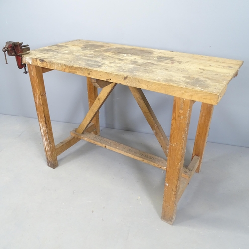 2572 - A homemade pine workbench with small fitted vice. 122x84x59cm.