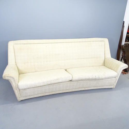 2578 - A mid-century cream upholstered 4 seater sofa on castors. 218x88x84cm. Seat - 175x40x56cm.