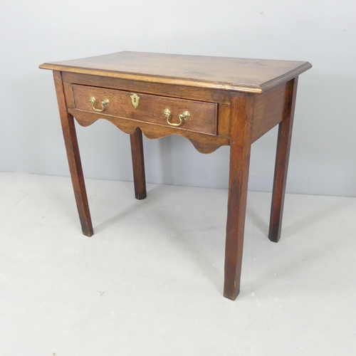 2564 - A 19th century style oak side table with single frieze drawer. 87x75x47cm.