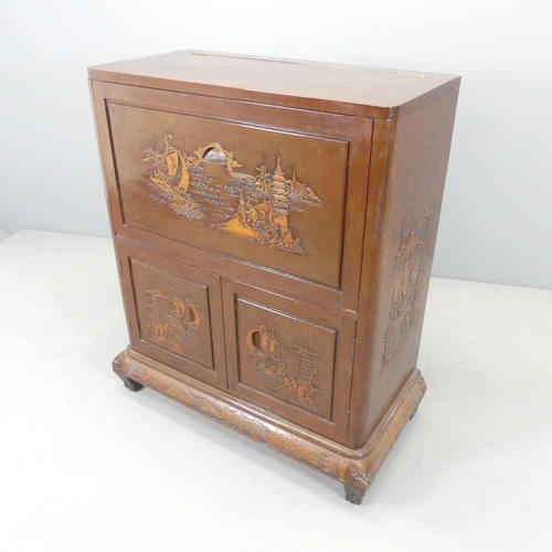 2573 - A Chinese cocktail cabinet, the top compartment having a rising top and fall front revealing a mirro... 