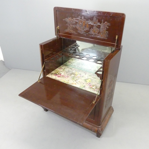 2573 - A Chinese cocktail cabinet, the top compartment having a rising top and fall front revealing a mirro... 