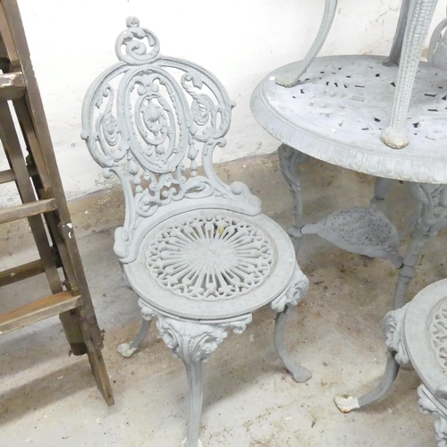 2580 - A cast iron continental style painted two-tier garden table, 70x73cm, with four matching chairs.