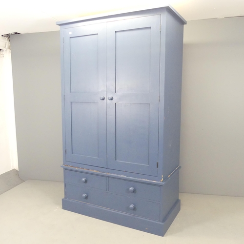 2584 - A modern painted pine two section wardrobe, with two panelled doors and three drawers below. 118x197... 