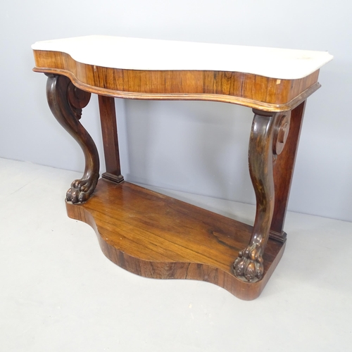 2597 - A 19th century French rosewood and marble topped console table of serpentine form, with scrolled leg... 