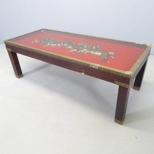 2603 - A mahogany and brass mounted coffee table with inset brass horse group under glass panel to top. 108... 