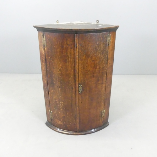 2593 - A 19th century mahogany hanging corner cabinet. 58x86x41cm.