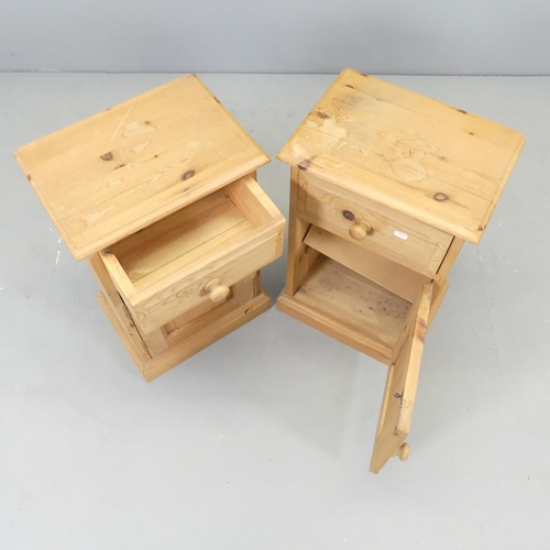 2595 - A pair of modern pine bedside pot cupboards. 39x62x28cm.