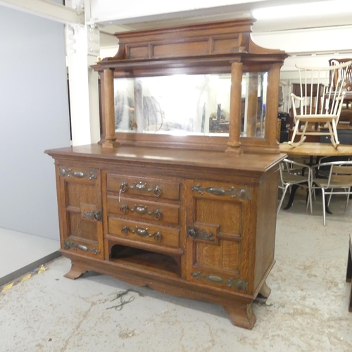 2598 - An early 20th century Art Nouveau style sideboard, with raised mirror back, and three drawers betwee... 