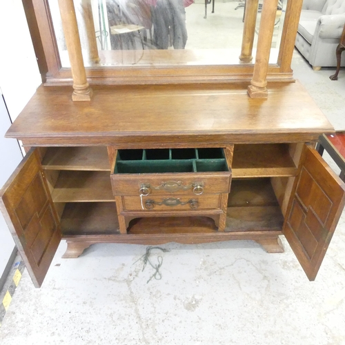 2598 - An early 20th century Art Nouveau style sideboard, with raised mirror back, and three drawers betwee... 