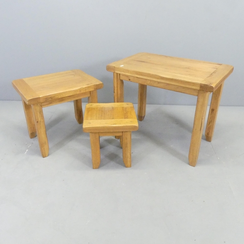 2611 - A modern oak nest of three occasional tables. Largest 65x53x42cm.