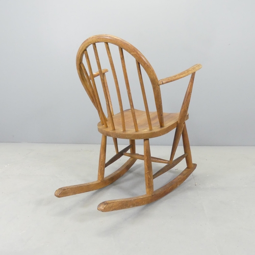 2622 - An Ercol Utility rocking chair, with impressed utility mark to rear of seat.