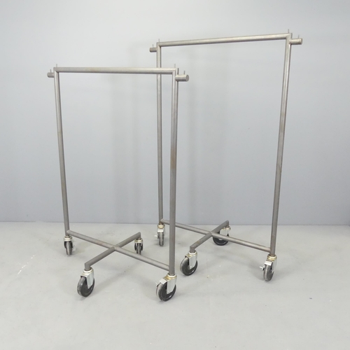 2629 - Two similar tubular metal shop display clothes rails on wheeled base. Tallest 101x147x54cm.