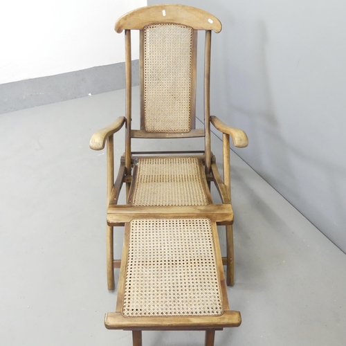 2630 - A vintage teak and cane panelled folding steamer lounge chair.