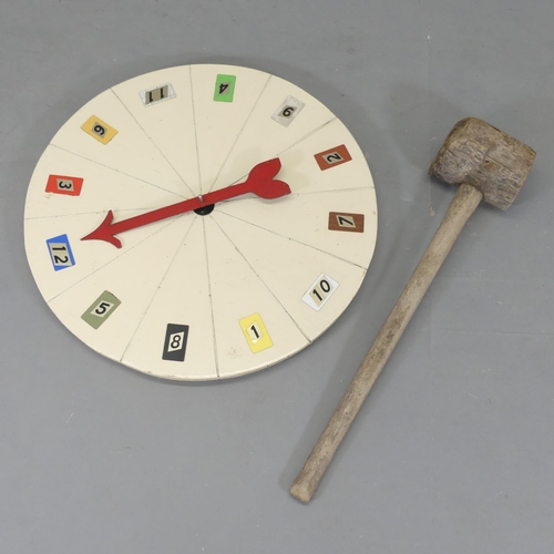 2632 - A vintage fairground strongman's hammer, length 90cm, and roulette wheel, diameter 77cm. (2)