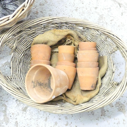 2678 - Three wicker baskets, tallest 46x35cm, and 16 terracotta pots.