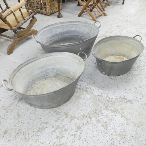 2679 - Three graduated galvanised metal wash basins. Largest 89x32x57cm.