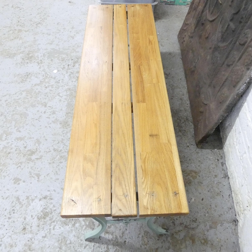 2684 - A teak plank top garden bench / low table on painted cast iron base. 120x43x36cm.