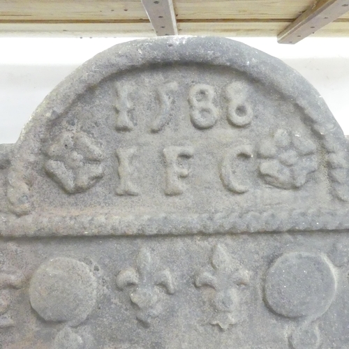 2685 - An antique cast iron fireback, dated 1588 (?), with anchor decoration. 104x87x6cm.