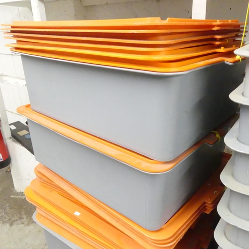 2687 - Twenty-five plastic stacking storage crates with lids. 60x18x46cm.