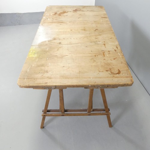 2636 - A vintage pine folding trestle table. 131x68x68cm.