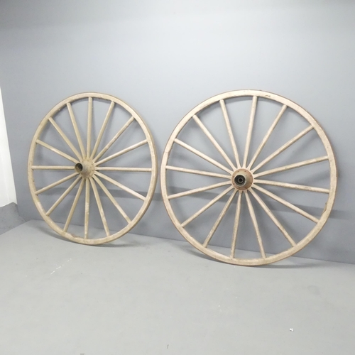 2710 - A pair of carriage wheels. 130x25cm.