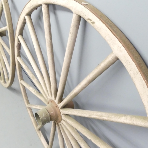 2710 - A pair of carriage wheels. 130x25cm.