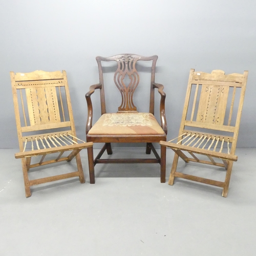 2717 - Two similar folk art style folding chairs, and a Chippendale style mahogany and upholstered open arm... 