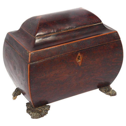 10 - A walnut sarcophagus tea caddy, 2 inner fitted lids, on cast brass feet, W21cm