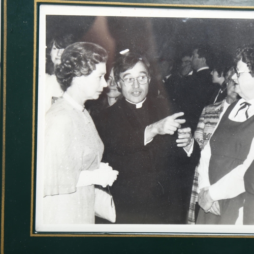 111 - A framed photograph of Her Majesty Queen Elizabeth II during an official visit