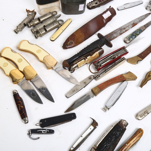 113 - A Commando  knife with ribbed handle, cased Leatherman tool, and a selection of Vintage penknives, w... 