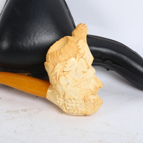 115 - A Meerschaum pipe with a carved man's head bowl, cased