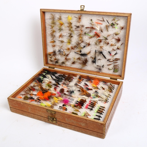 122 - A large collection of Vintage and other fishing flies, double-cased