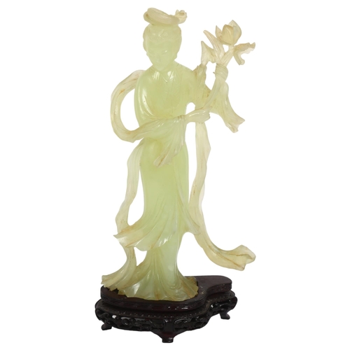 126 - A jadeite figure of a Chinese lady holding flowers on stand, H26cm