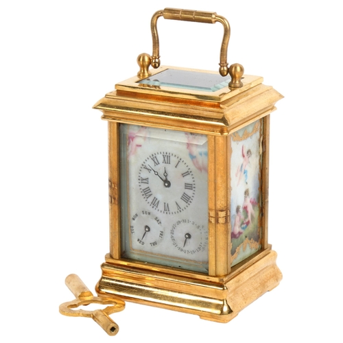 129 - A miniature brass-cased carriage clock, with calendar and day dials and painted ceramic panels, heig... 