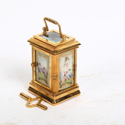 129 - A miniature brass-cased carriage clock, with calendar and day dials and painted ceramic panels, heig... 