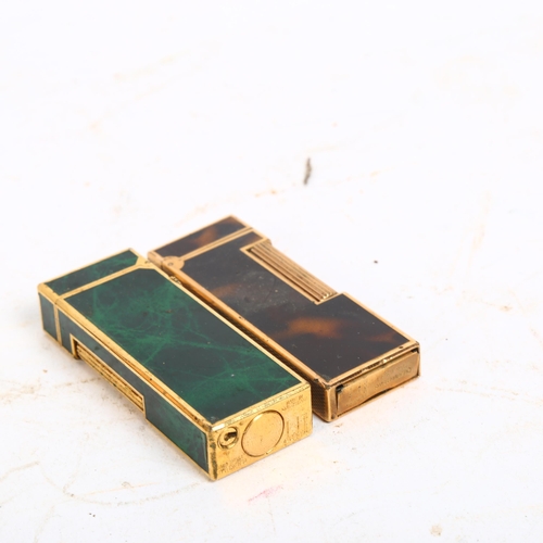 136 - 2 cased Dunhill lighters, 1 with malachite panels, the other having tigers eye style design panels, ... 