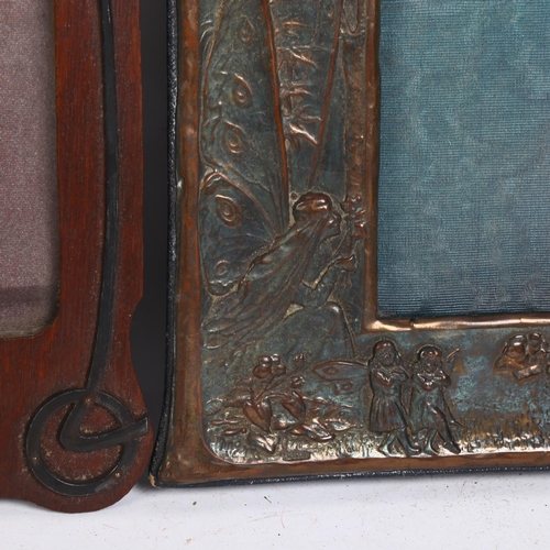 137 - An Art Nouveau embossed copper-mounted photo frame, and a 1920s oak photo frame with applied decorat... 