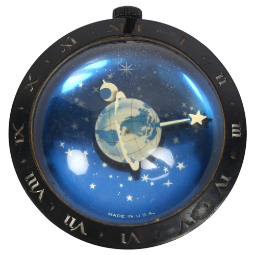 142 - An Art Deco Westclox earth moon and stars clock paperweight, patented in the USA 98049, diameter 7.5... 