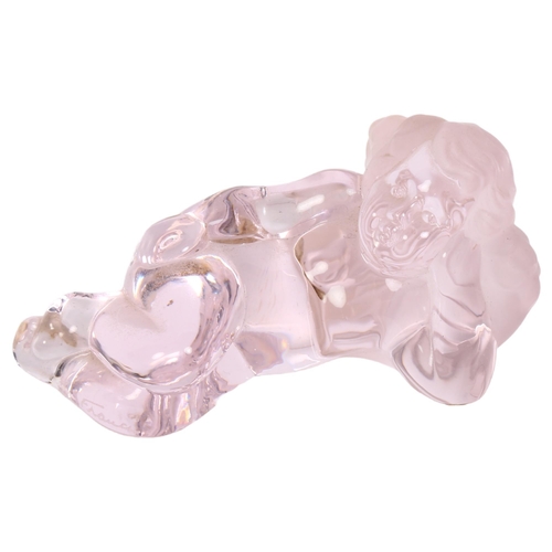 144 - Daum, France, glass paperweight in the form of a reclining cherub